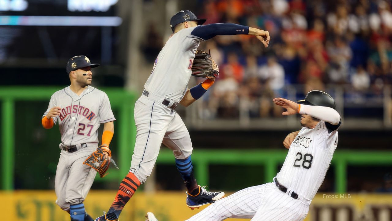 Nolan Arenado y Carlos Correa.