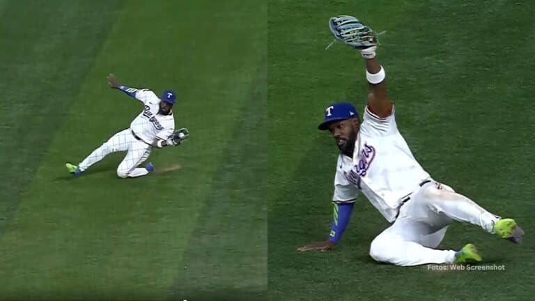 Adolis Garcia deslizándose en la grama para atrapar una pelota con Texas Rangers