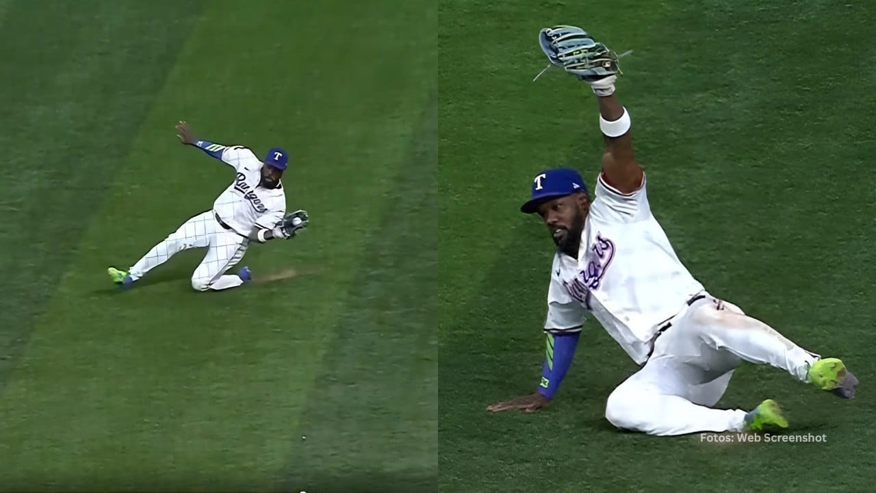 Adolis Garcia deslizándose en la grama para atrapar una pelota con Texas Rangers