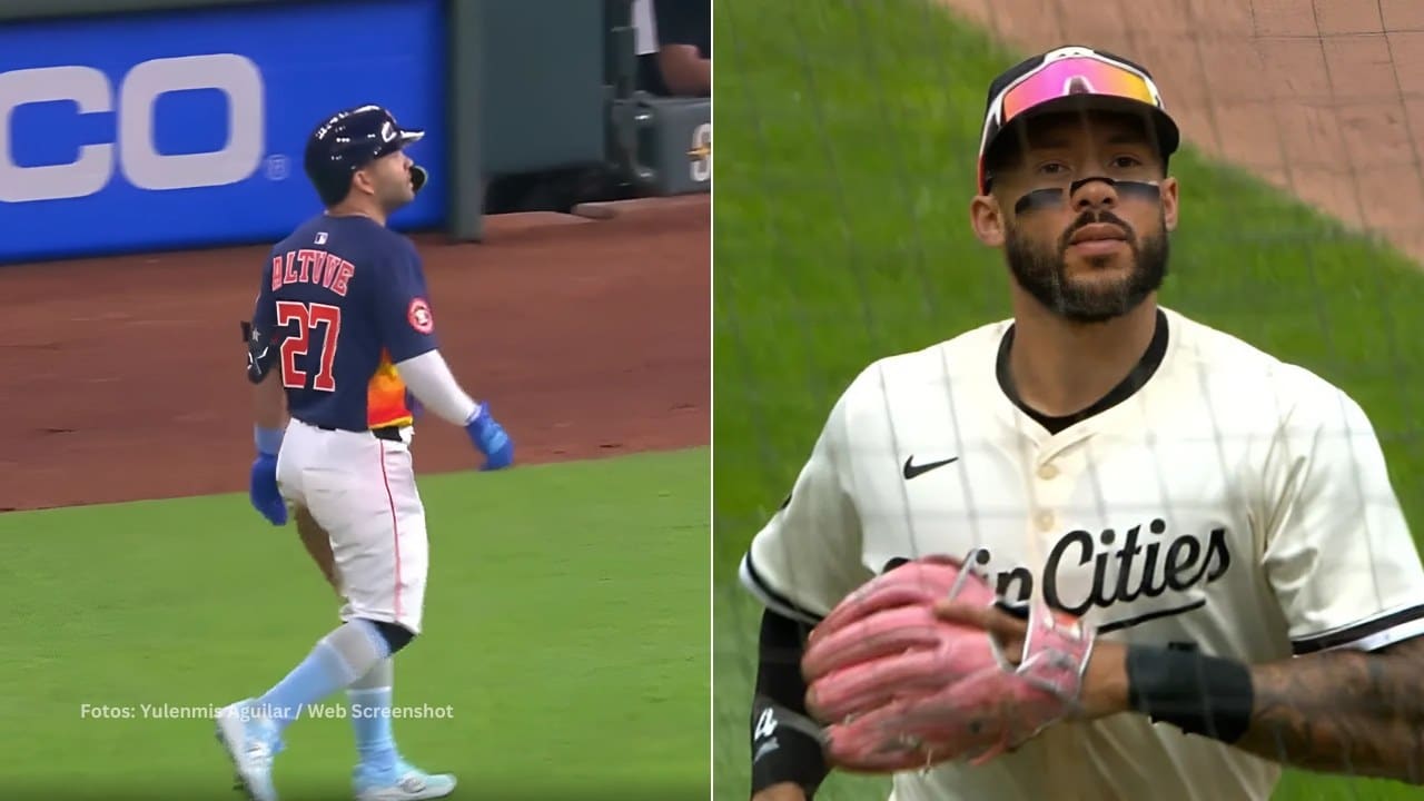 Jose Altuve en la inicial tras ganarle la carrera a Carlos Correa