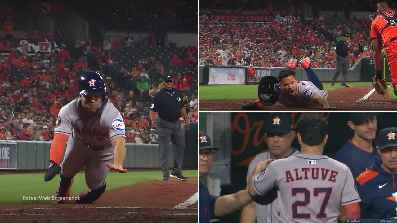 Jose Altuve se desliza en el home plate para anotar en carrera con Houston Astros